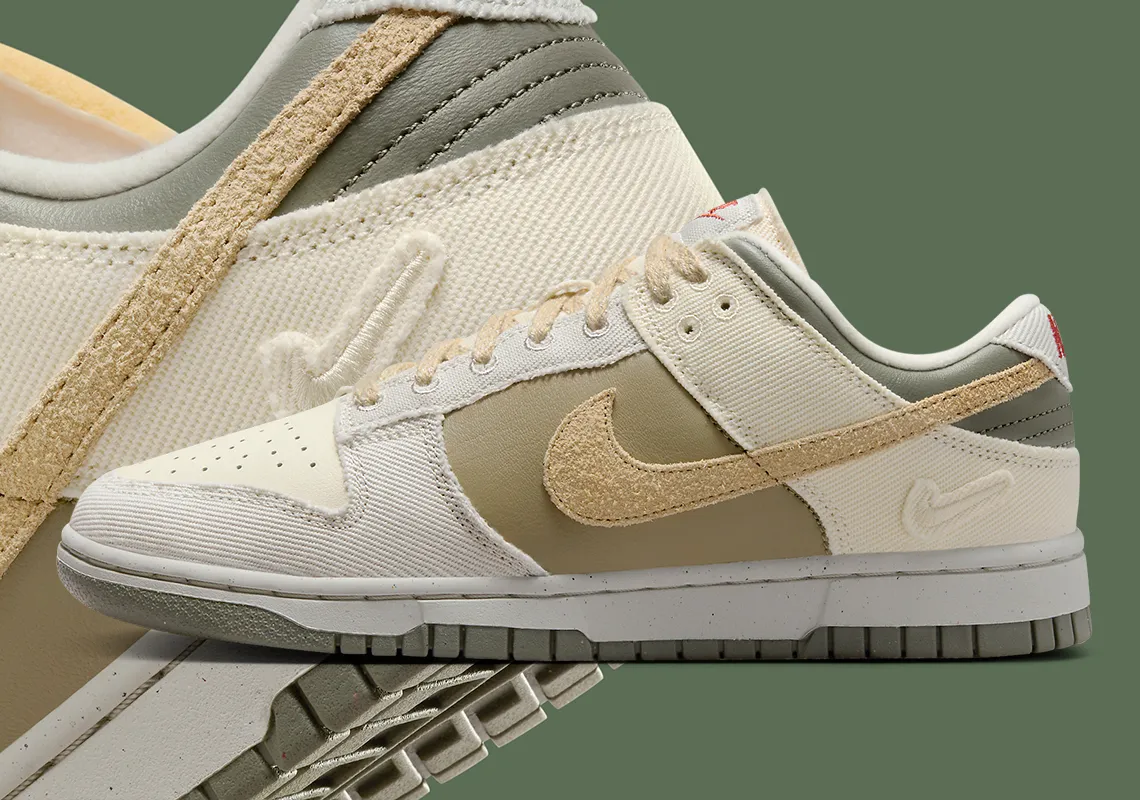 A fusion of canvas, suede, and leather comes together in earth-toned hues for the Nike Dunk Low, with an additional Swoosh gracing the heel.